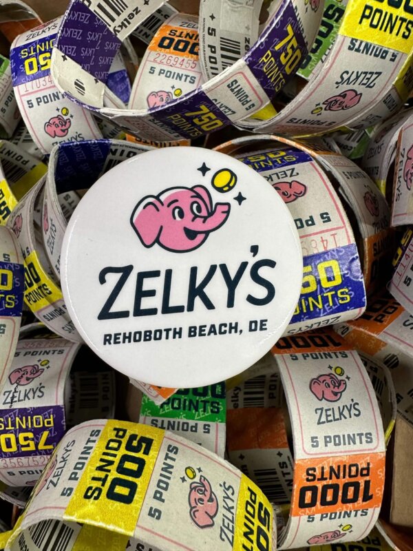 A pile of 5 0 point snacks with the logo for zelky 's.