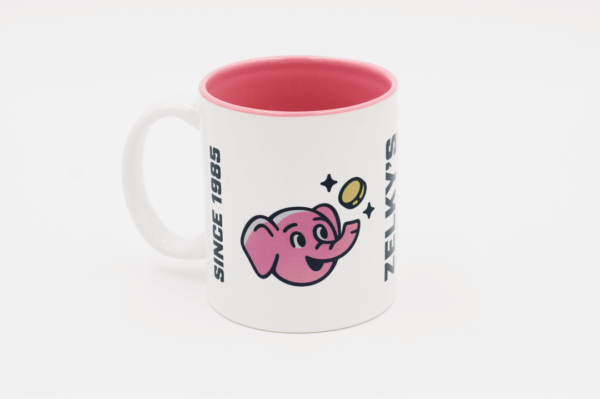 A pink and white mug with an elephant on it.