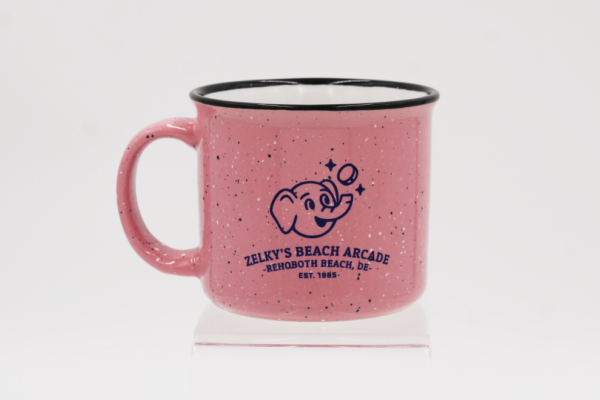 A pink mug with black speckles on it.