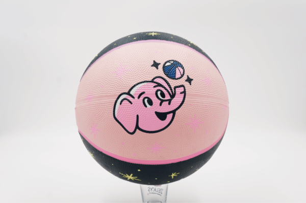 A pink basketball with an elephant on it.