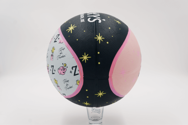 A ball with the words " love is in the air ".