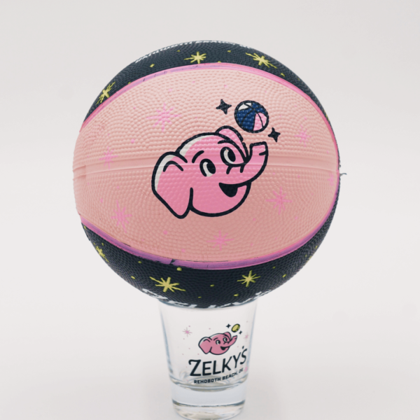 A pink elephant basketball with stars on it.