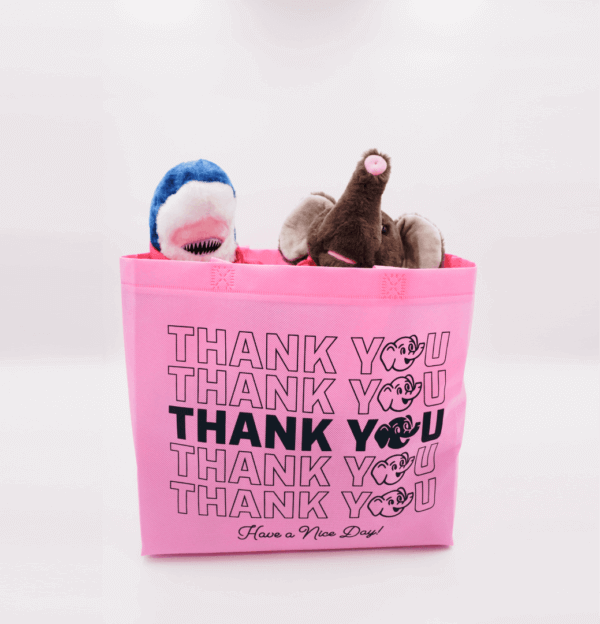 A pink bag with stuffed animals inside of it.